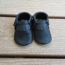 Load image into Gallery viewer, Black Soft leather baby moccs. Fringe moccs. Soft sole shoes. Handmade in Canada.